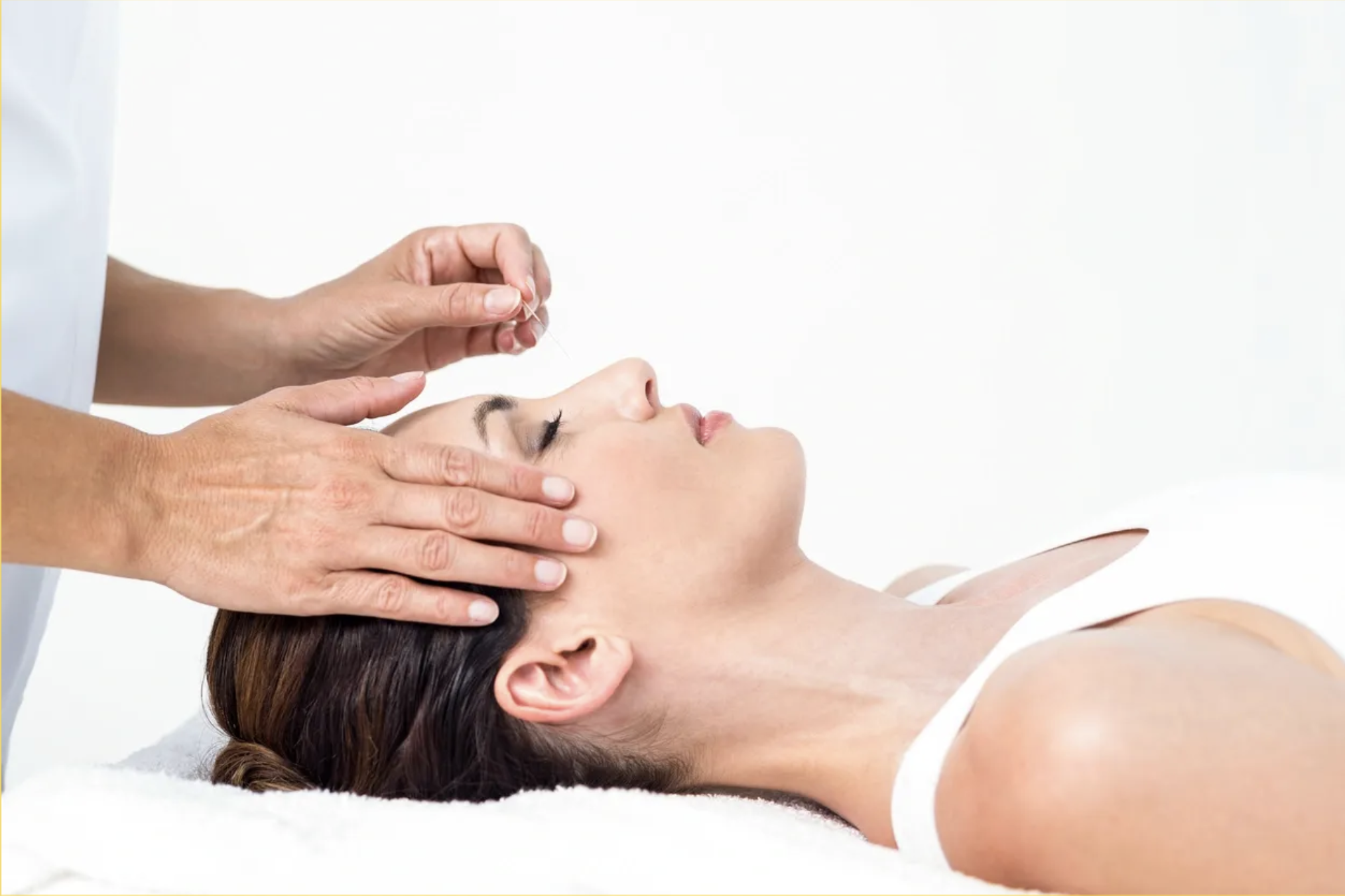Dr. Yasmin Harounian L.Ac providing caring and compassionate acupuncture treatment in her Los Angeles clinic